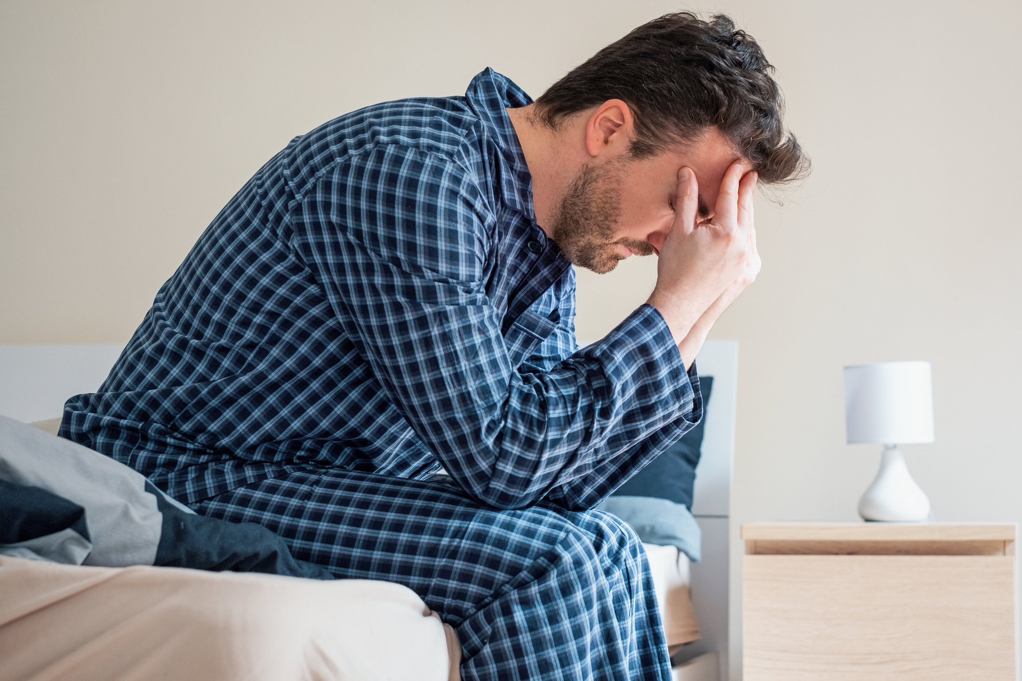 man alone in bed