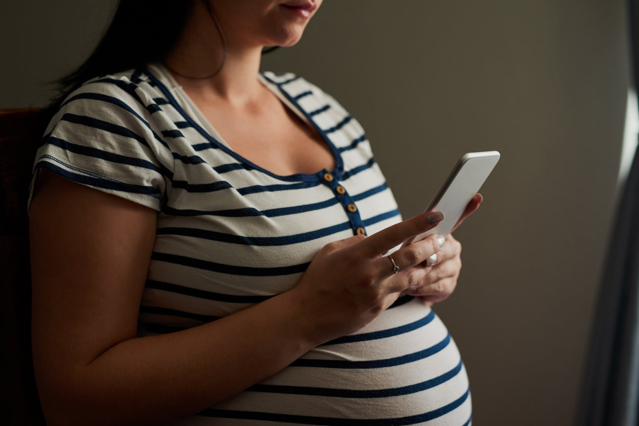 pregnant woman on phone