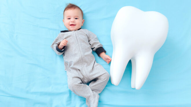 Baby and giant tooth