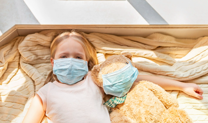 Child wears face mask