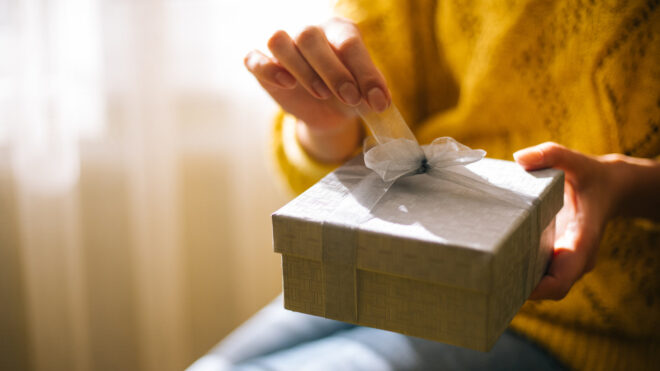 Woman opening gift