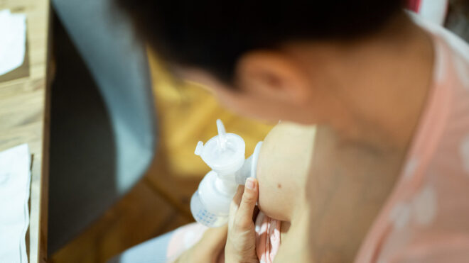 Mom pumping breast milk