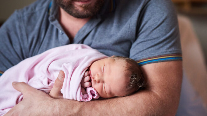 newdad holding baby