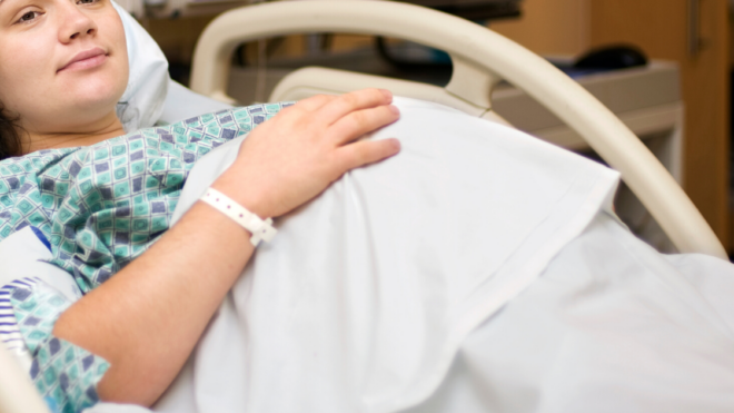 pregnant woman in hospital bed