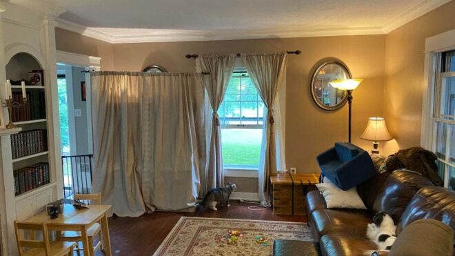 tv didden by the curtains