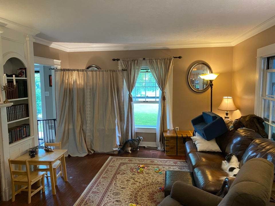tv didden by the curtains