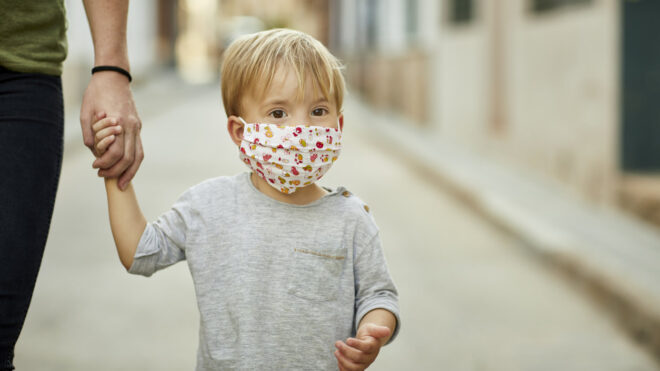 Little boy in a face mask