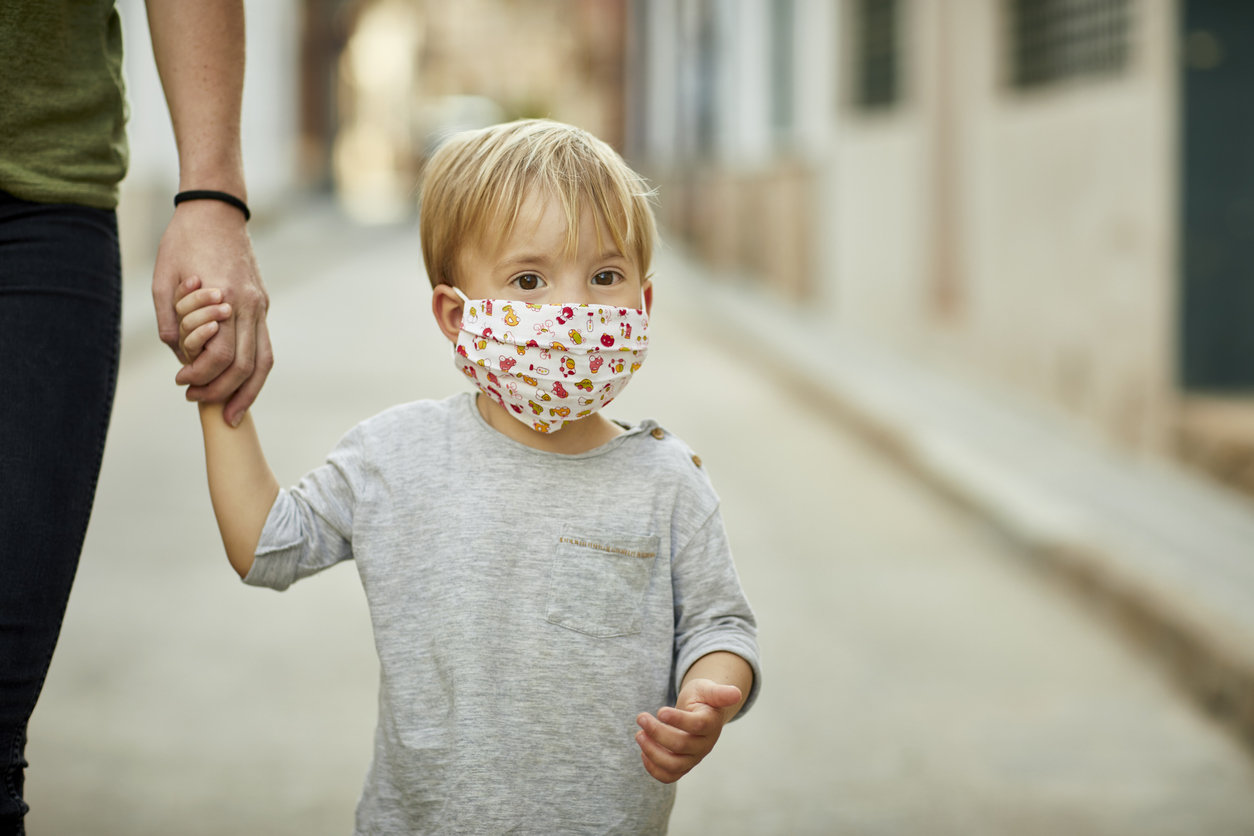 Little boy in a face mask