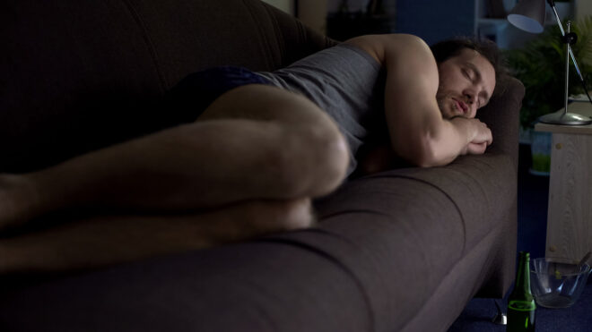 man sleeping couch
