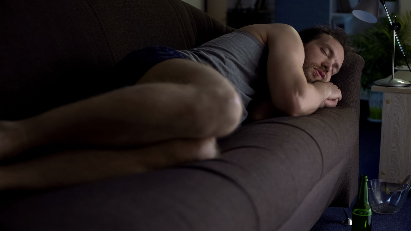 man sleeping couch