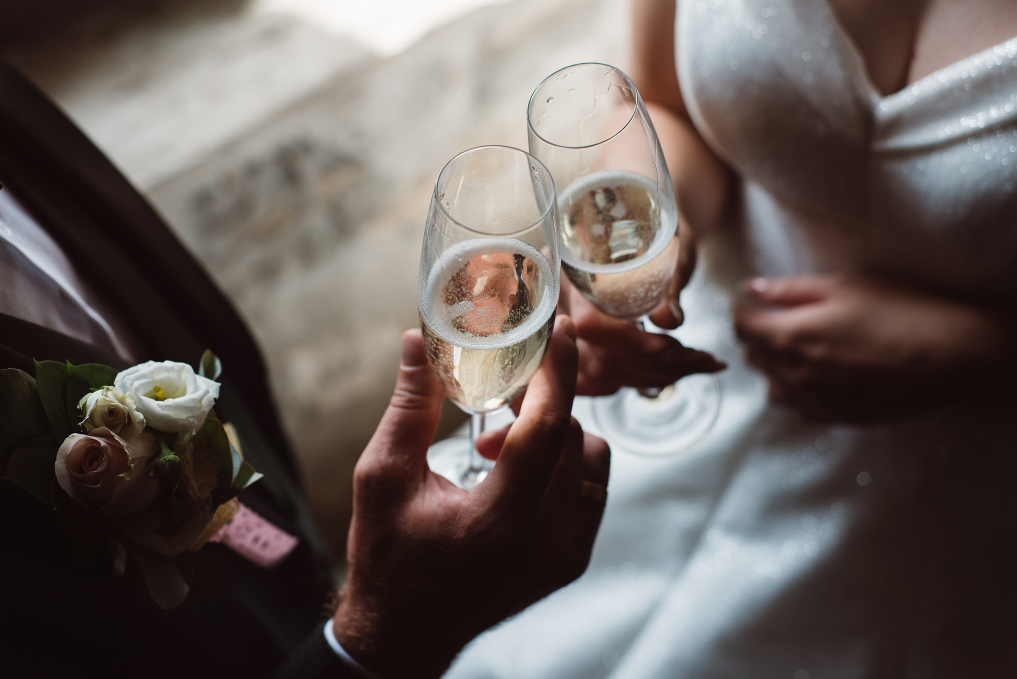 Bride and groom cheers champagne