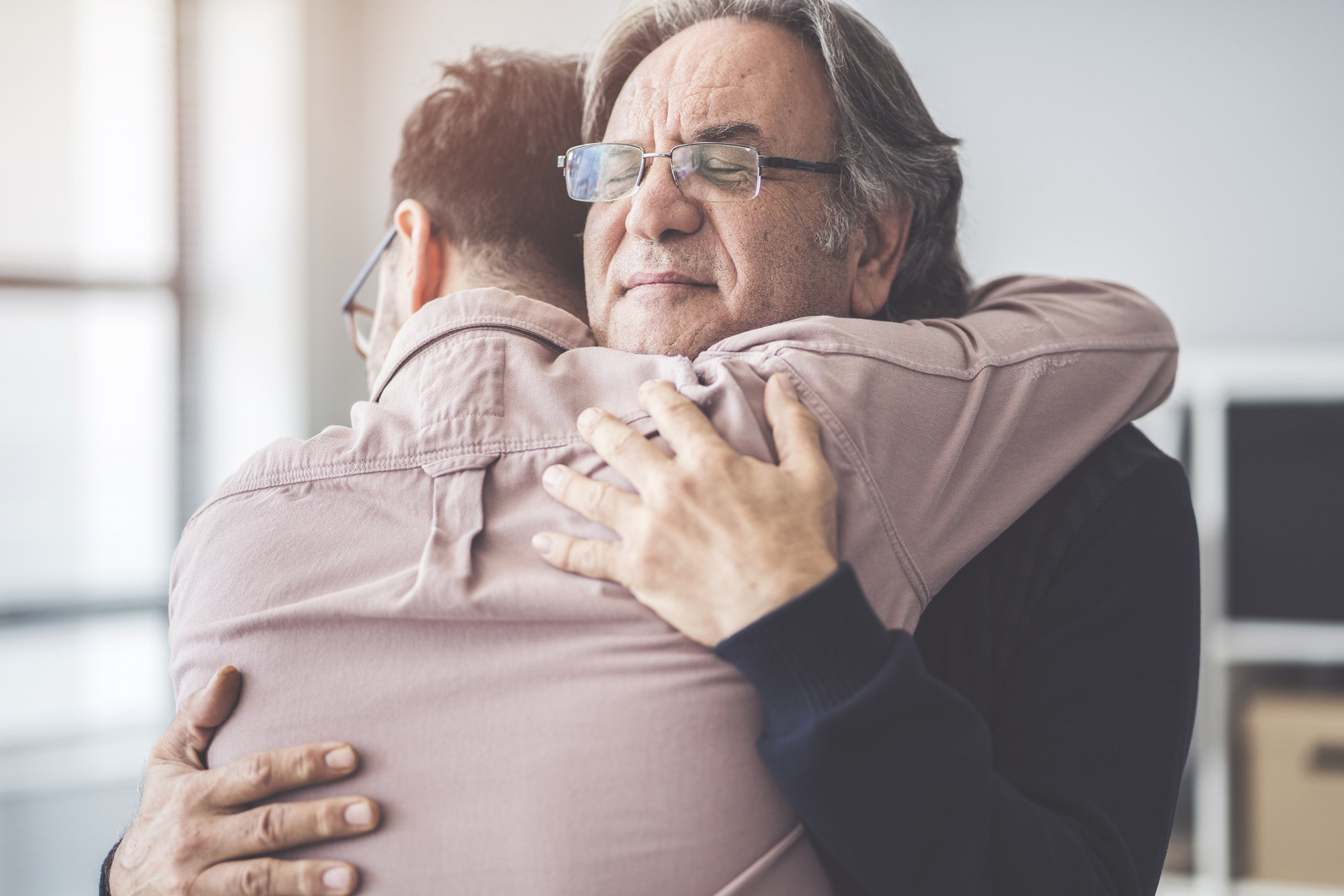 dad hugging son