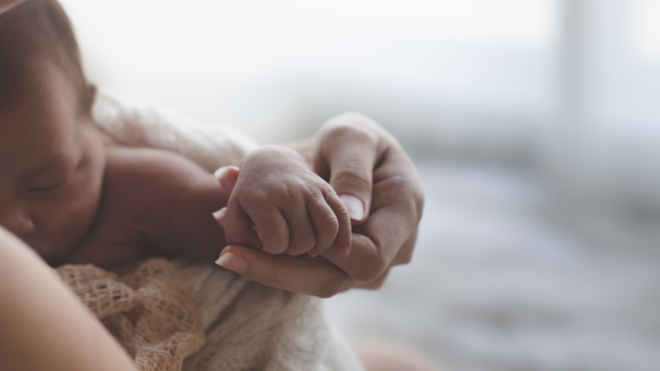 mom holding baby
