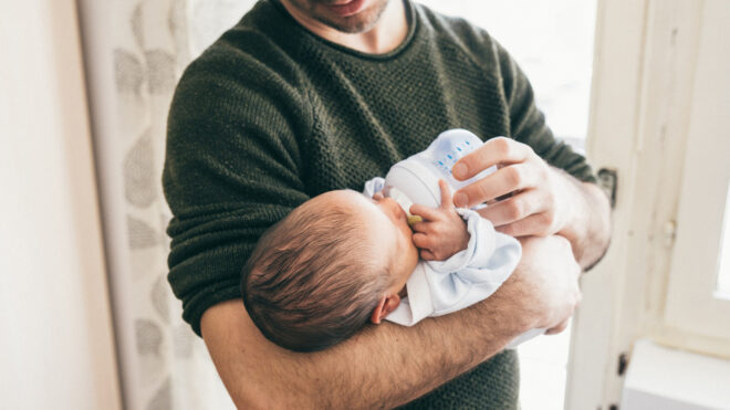 dad holding baby