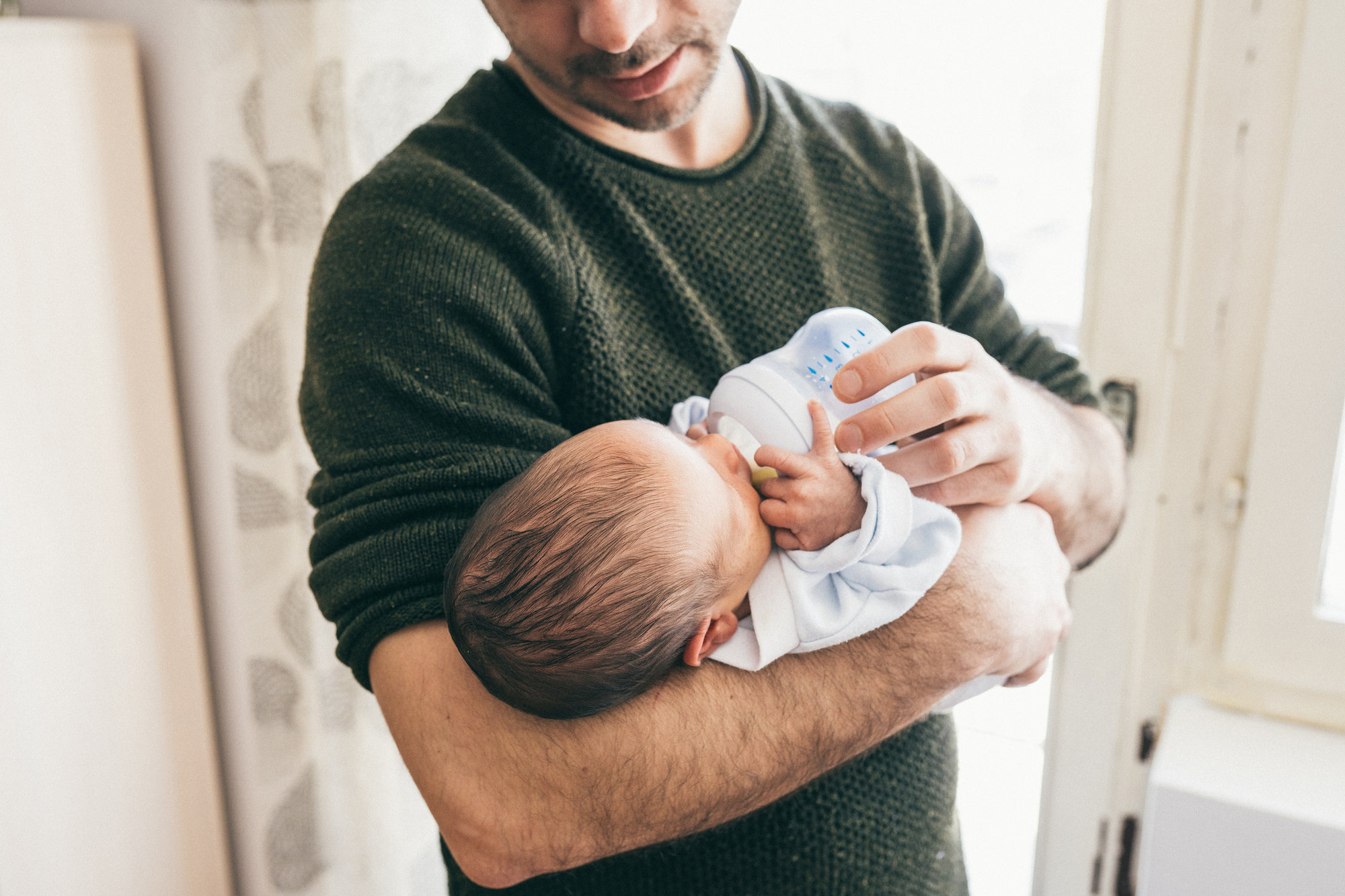 dad holding baby