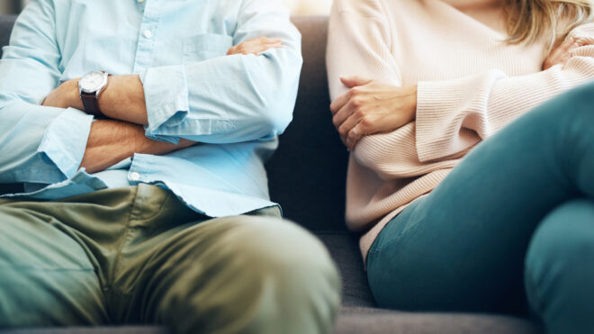 two people crossing their arms