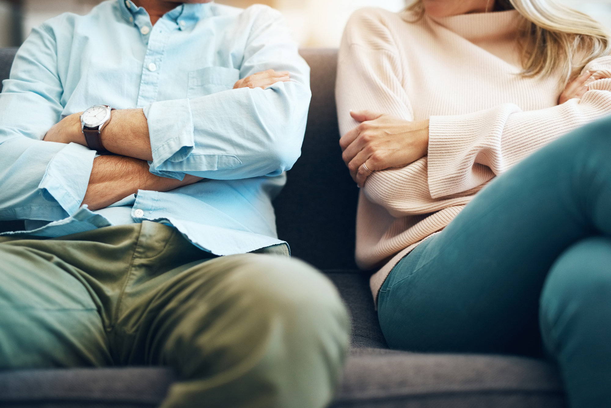 two people crossing their arms