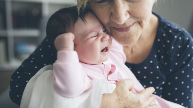 Grandma holds baby girl