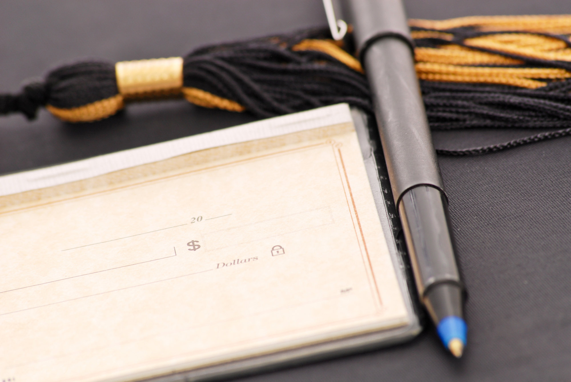 checkbook and tassle