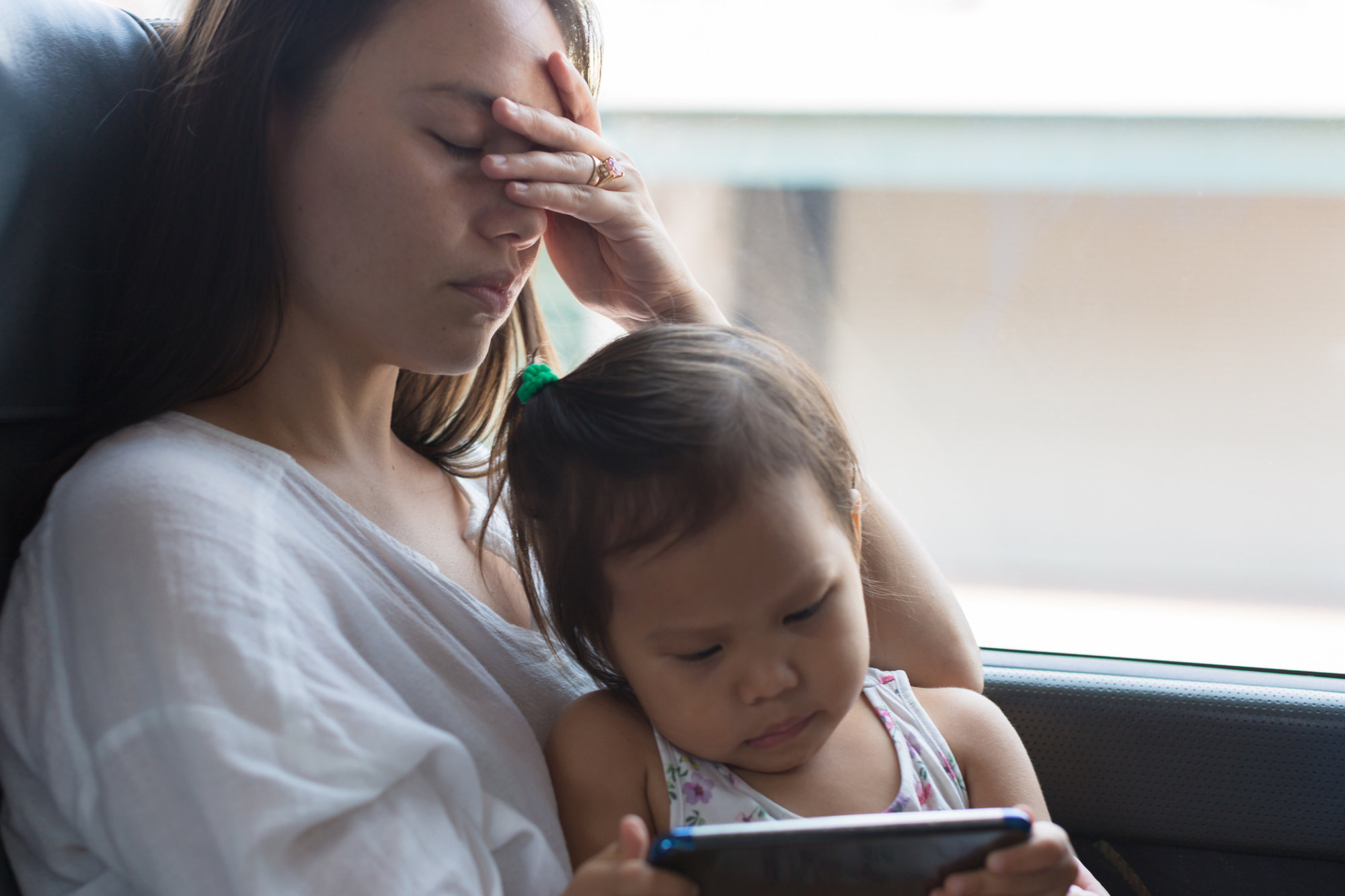 woman stressed with toddler