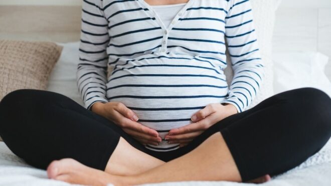 pregnant mom holding her belly