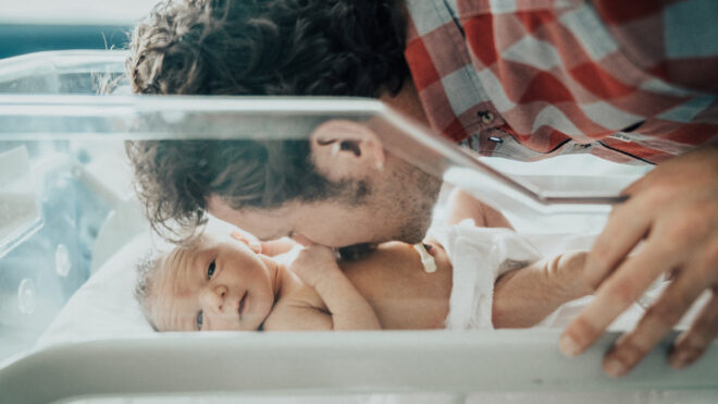 New dad and newborn at hospital