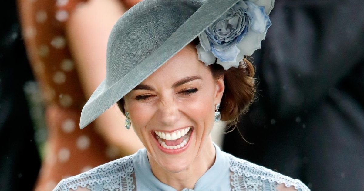 photo of Kate Middleton smiling while wearing a light blue hat