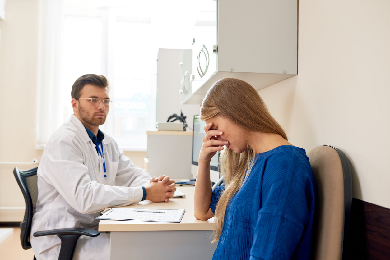 Woman crying at doctor's office