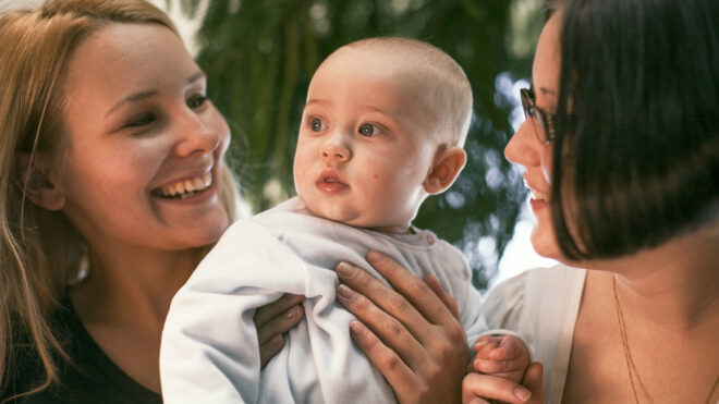 two women and a baby