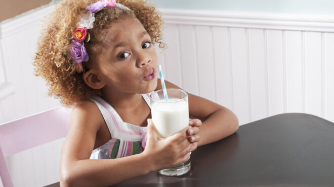 Little girl drinking milk
