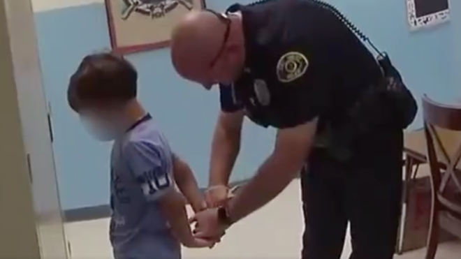 8-year-old boy is handcuffed