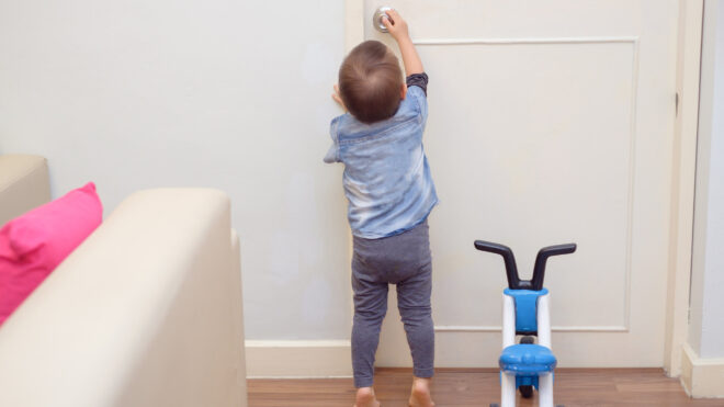little boy trying to get into office
