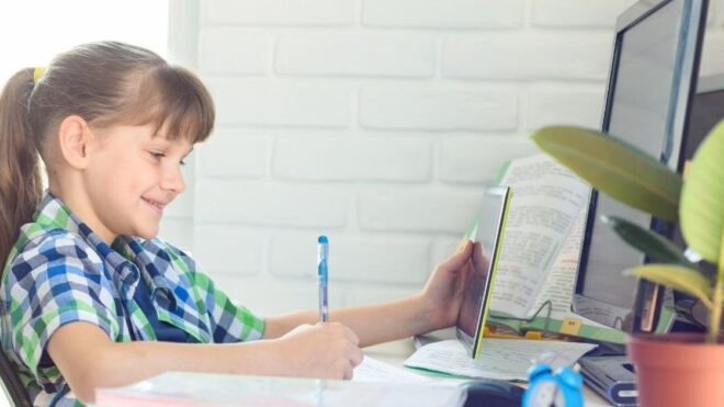 girl doing computer work for school