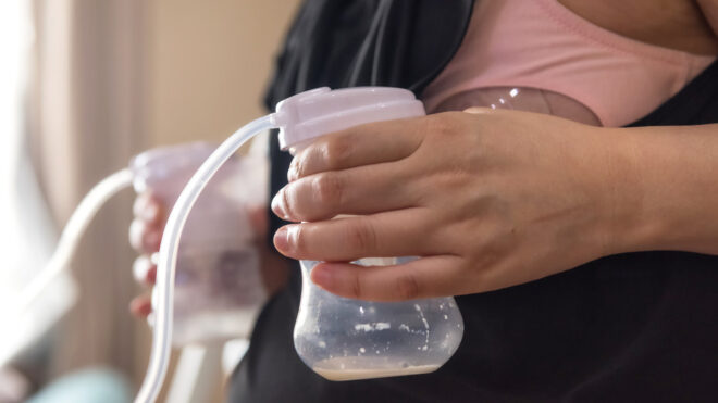 Woman pumping breast milk