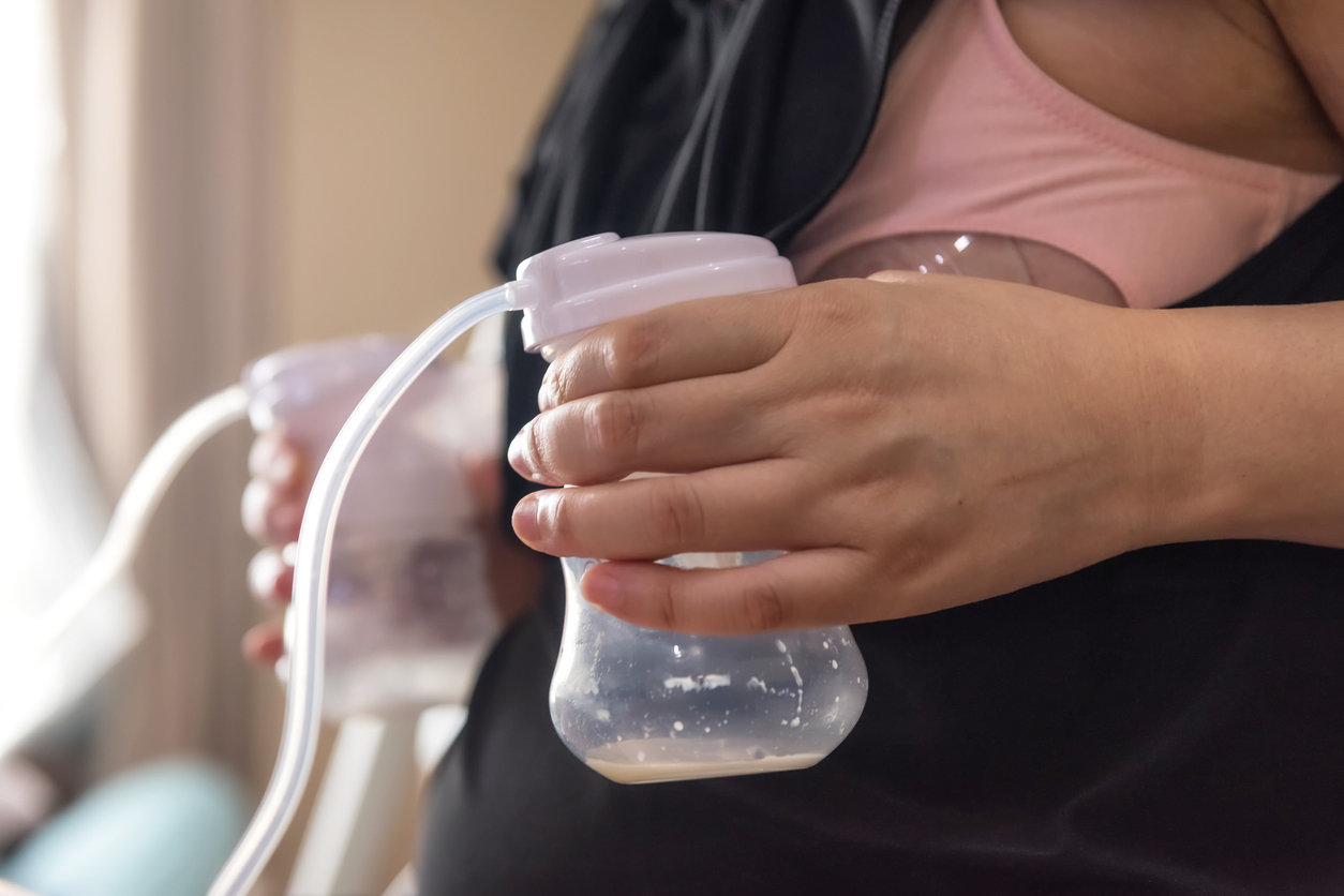 Woman pumping breast milk