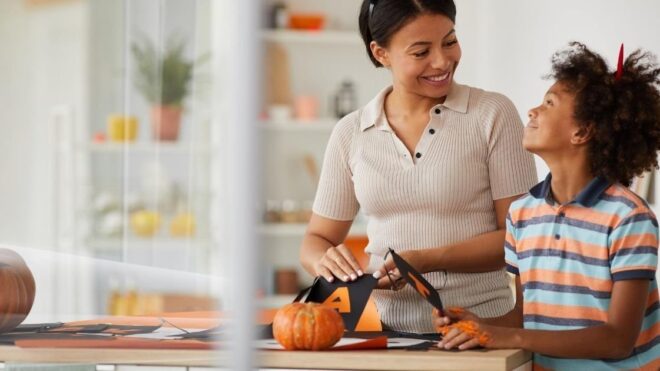 mom and son doing Halloween crafts