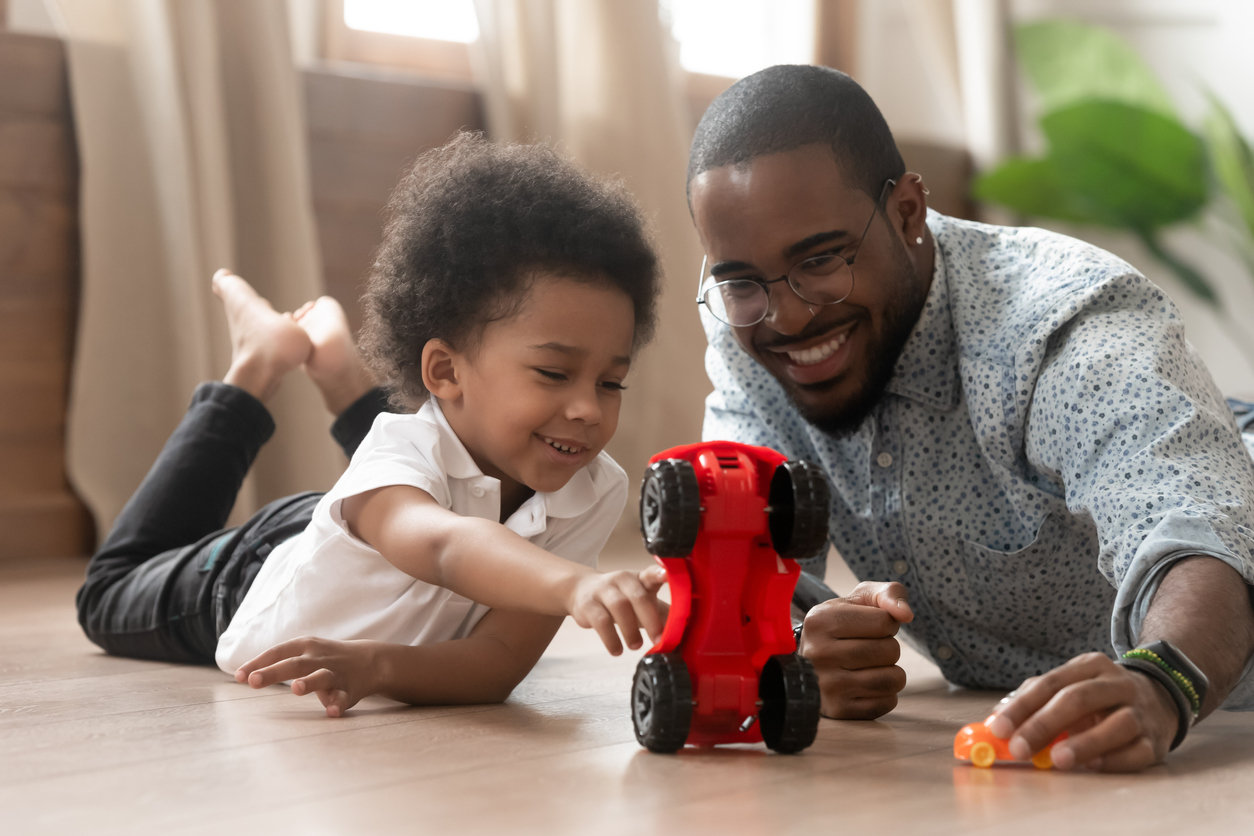 Dad and toddler playing