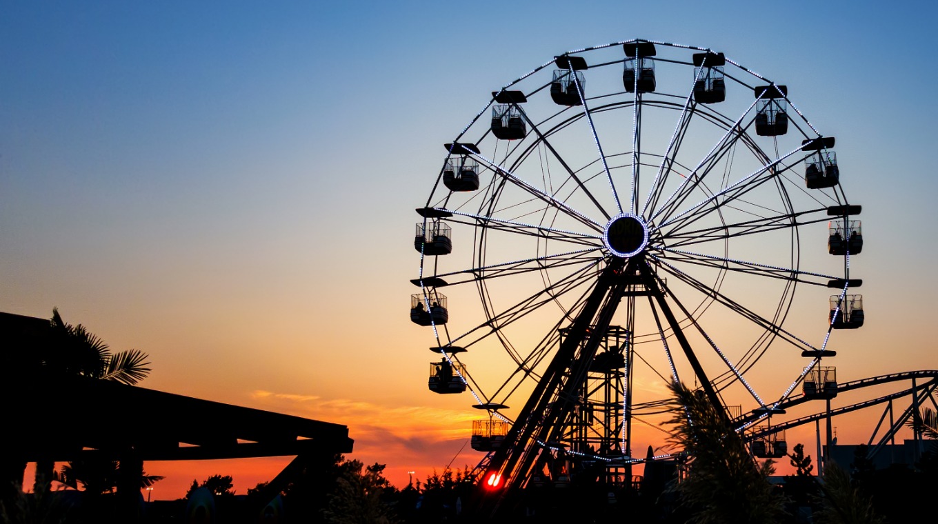 ferris-wheel-in-sunset-big-wheel-with-cabins-picture-id1030543912.jpg
