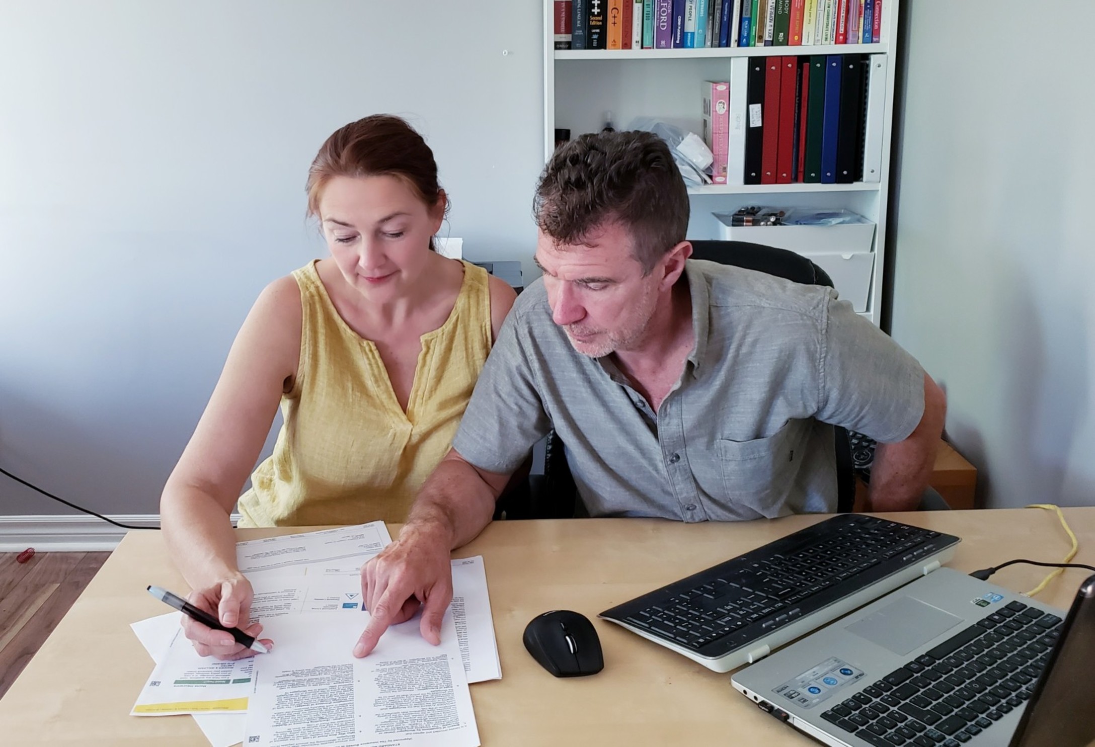 financial-married-couple-documents-middle-aged-man-middle-aged-woman-signing-older-couple_t20_Xvgba3.jpg