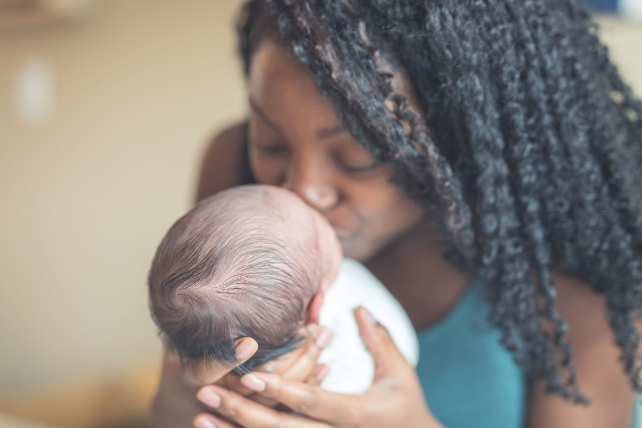 New Mom Holding Infant Daughter