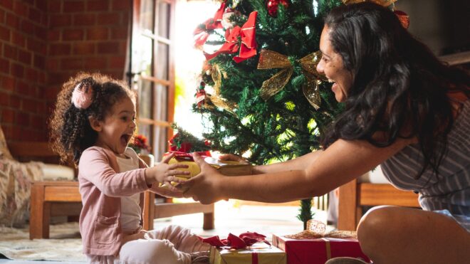 Mother giving child a gift