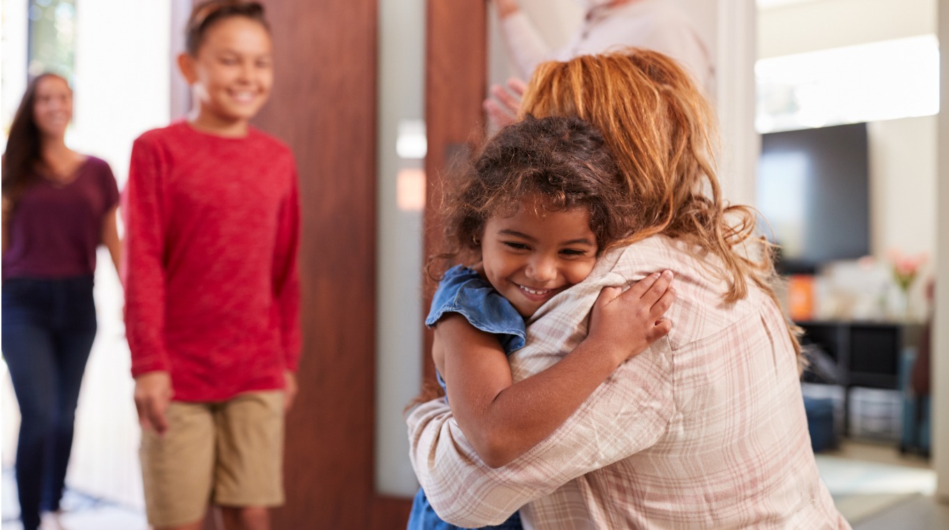 grandparents-greeting-grandchildren-at-front-door-as-they-comes-to-picture-id1224769597.jpg