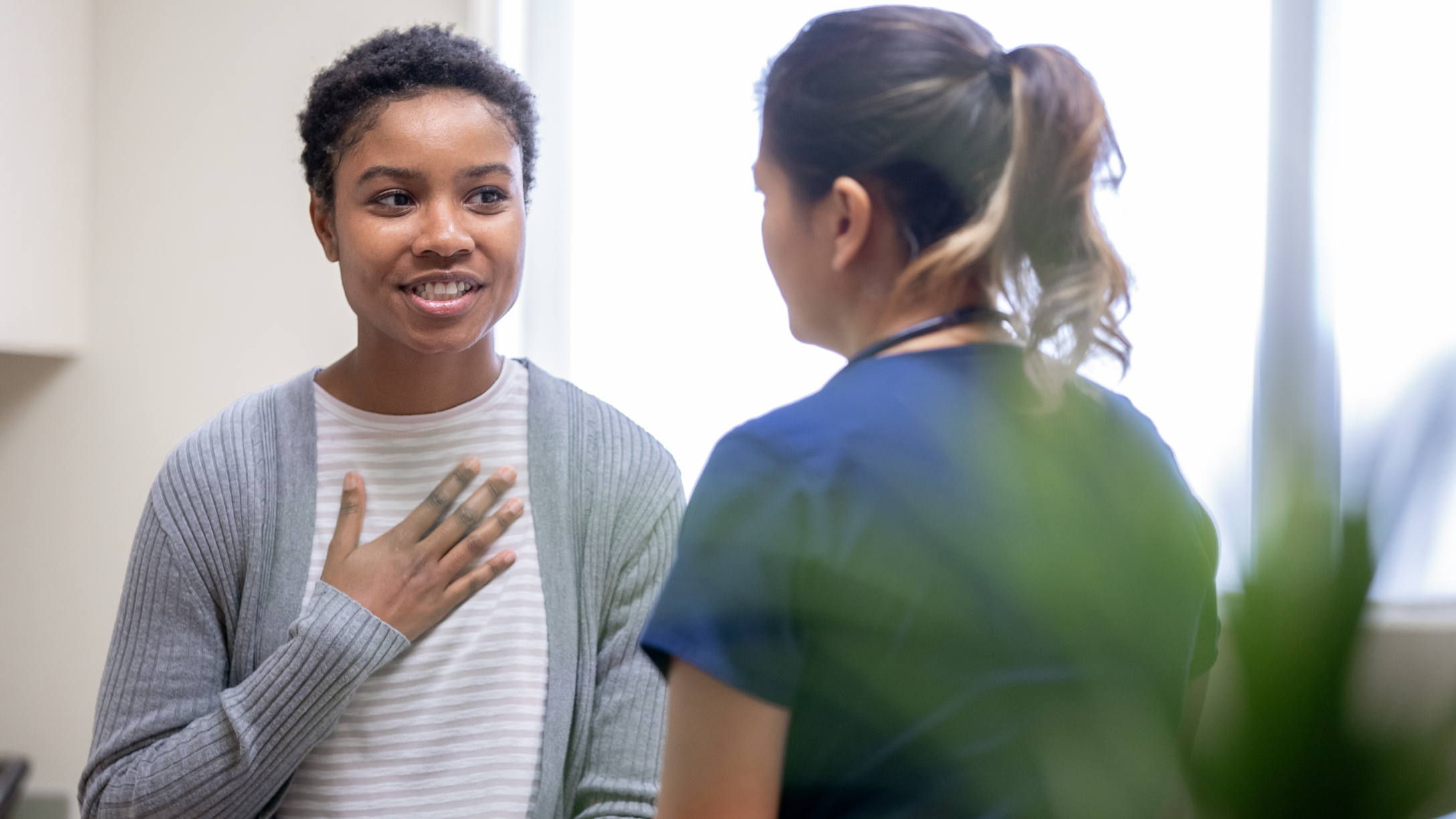 woman talking to health worker
