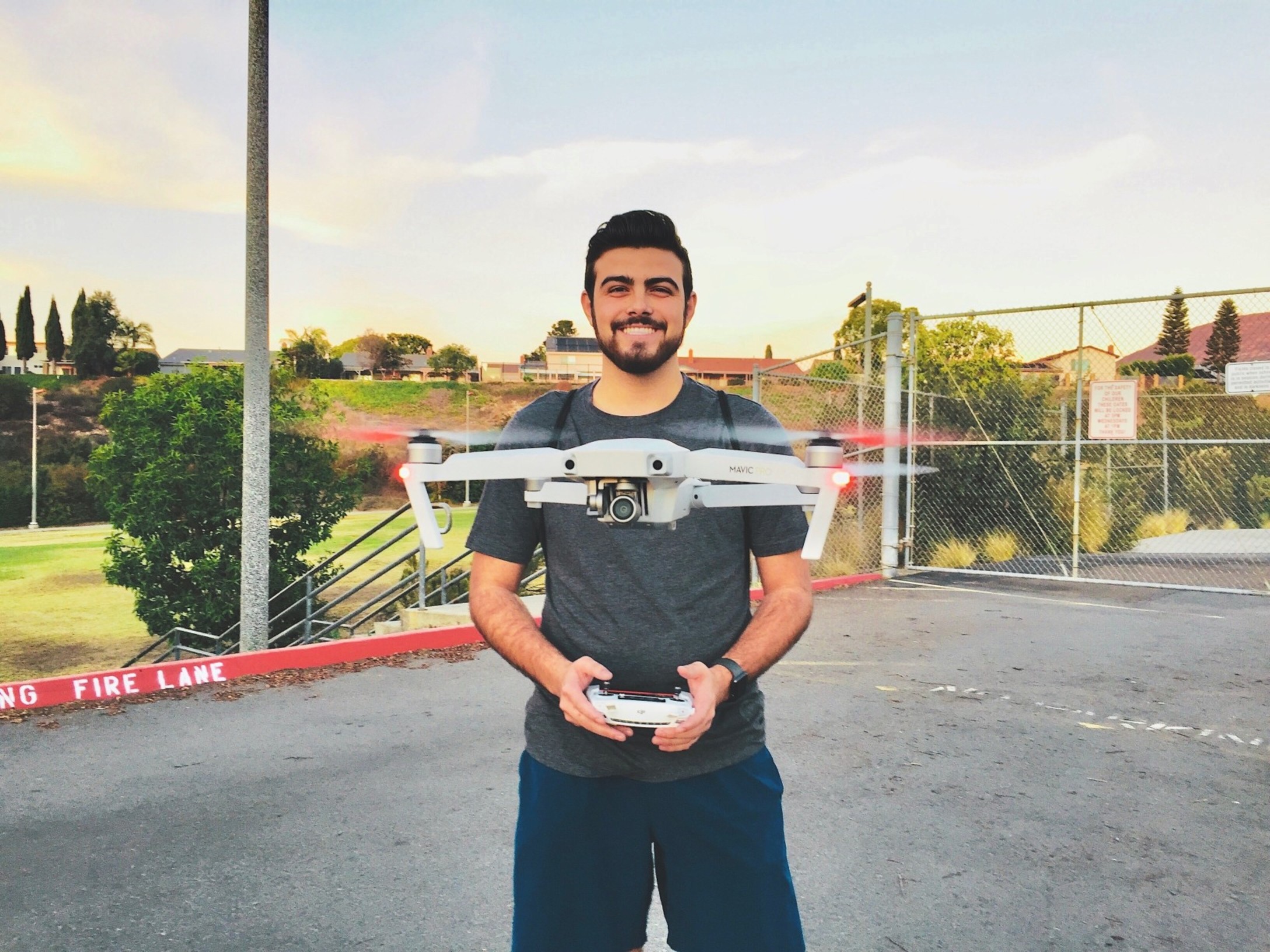 happy-millennial-flying-a-drone-control-controlling-using-awesome-amazing-man-tonythetigersson-tony_t20_3wev33.jpg