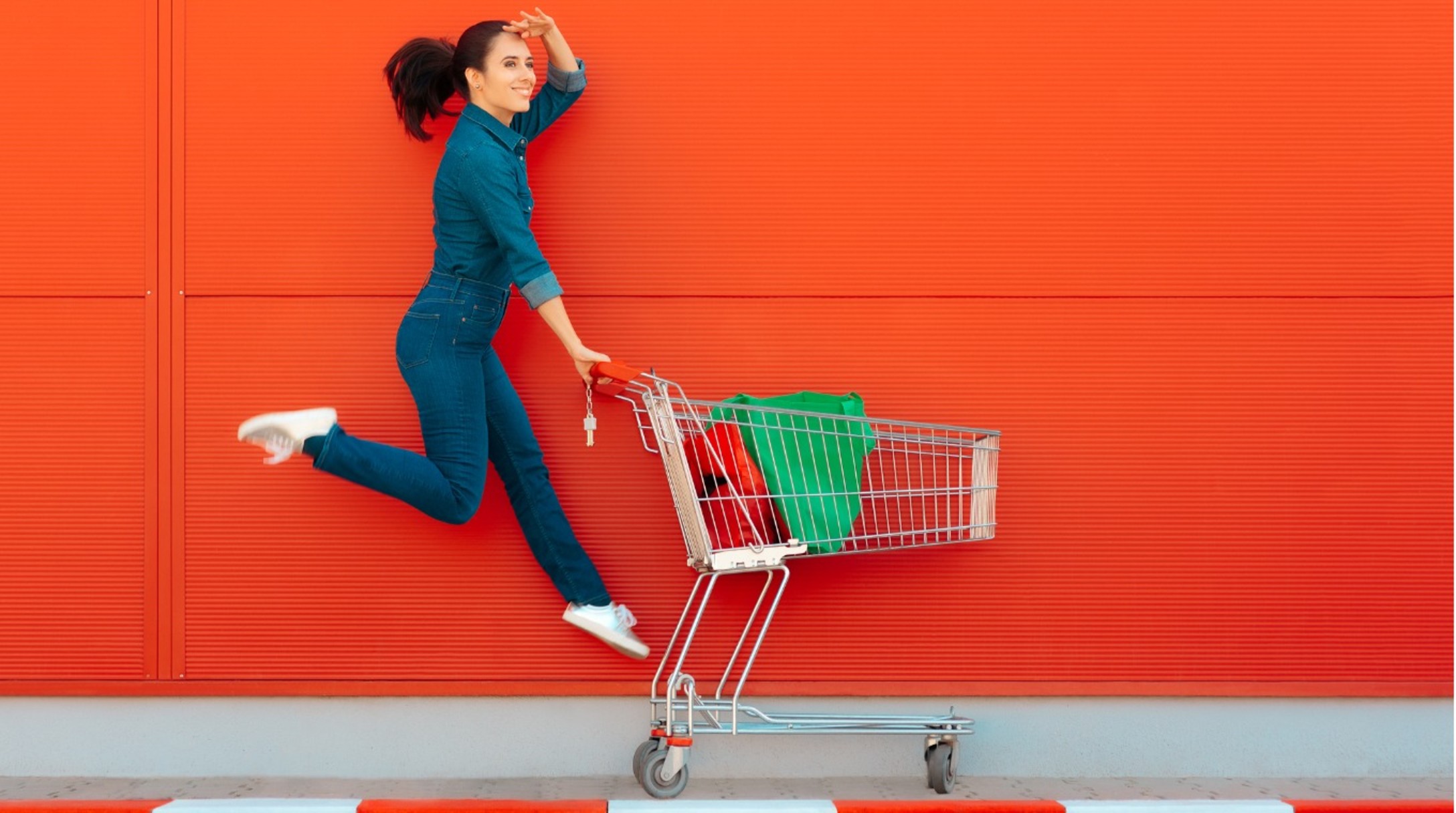 happy-woman-with-shopping-jumping-with-joy-picture-id1008207162.jpg