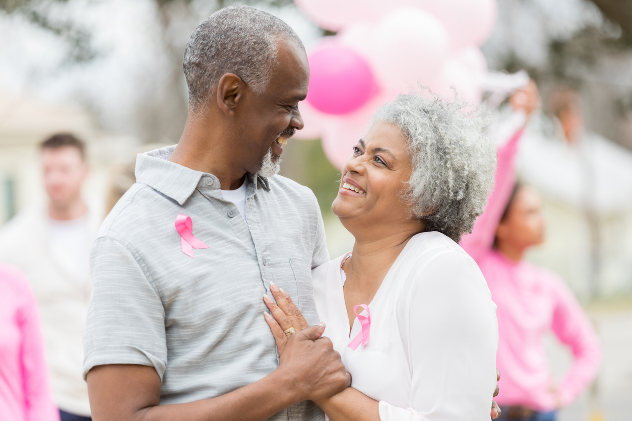 Loving senior couple attend cancer awareness furndraiser