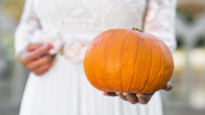 bride holding pumpkin