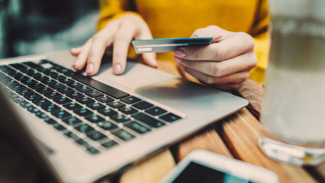 woman holding credit card