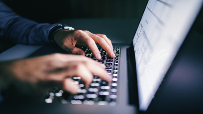 someone typing on computer