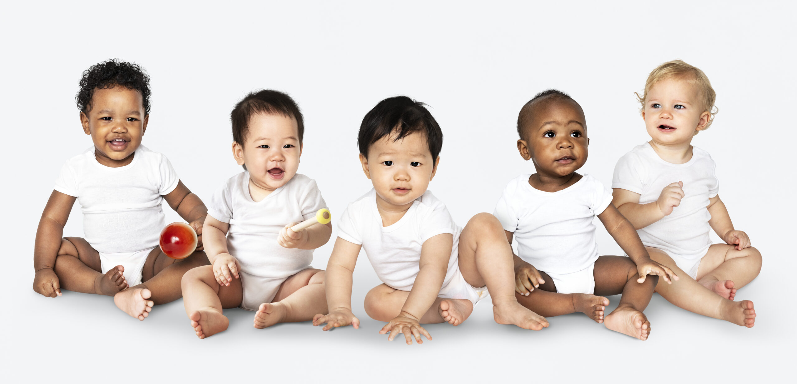 Diverse babies sitting on the floor